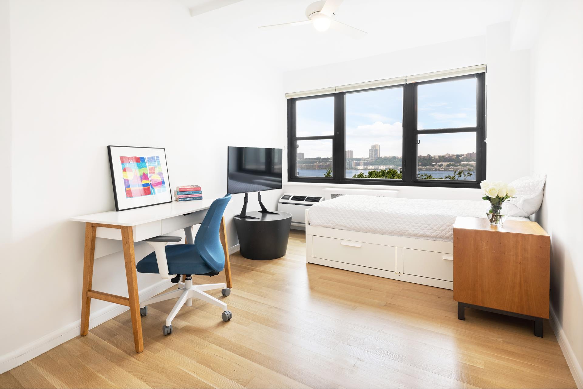 11 Riverside Drive, Unit 8JHW Manhattan, NY 10023 - Photo 8 of 15 a living room with furniture and a large window