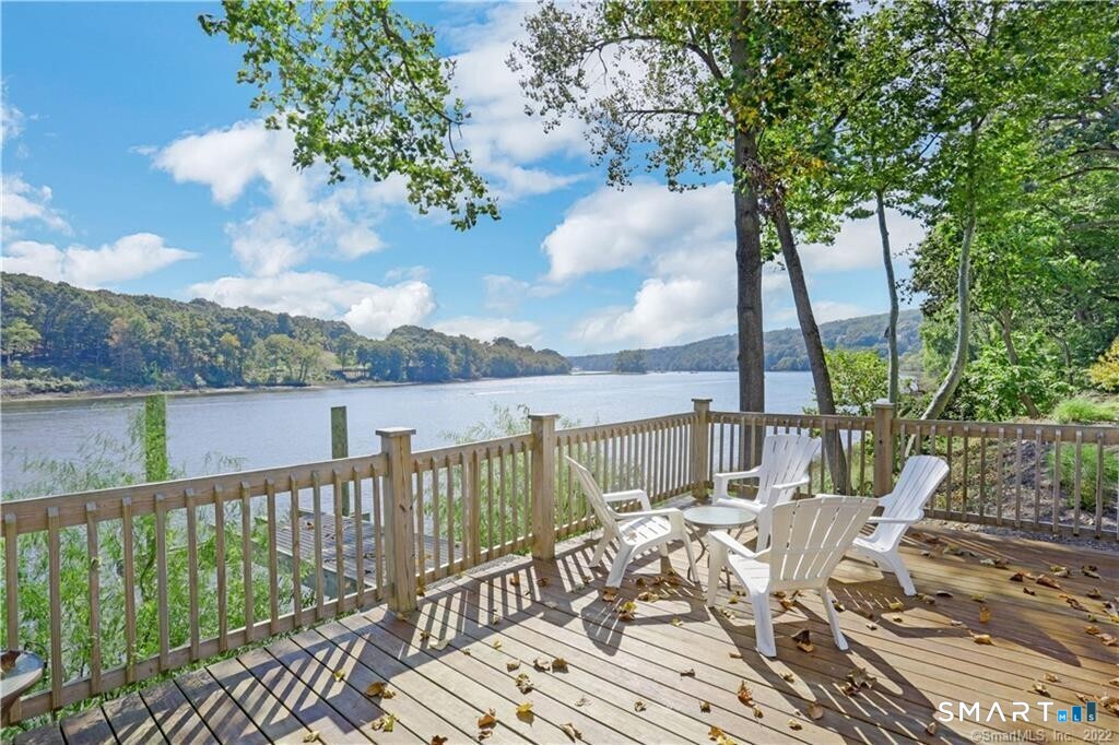 a view of a balcony with lake view and mountain view