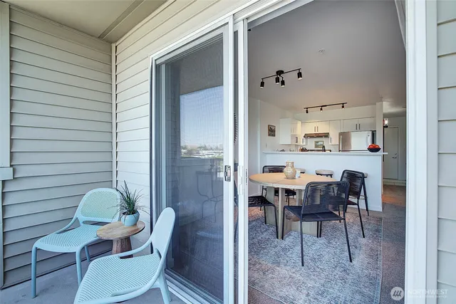 a view of balcony with furniture