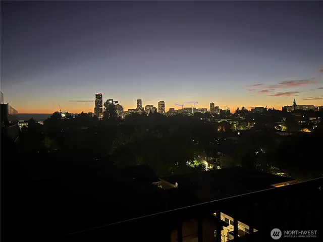 an aerial view of a house with outdoor seating