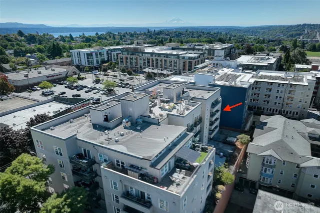 a view of an empty room with glass door and windows