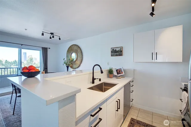 a stove top oven sitting inside of a kitchen