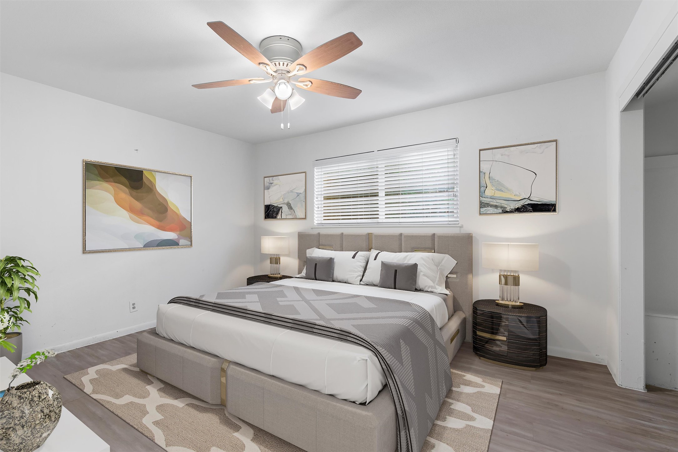 2208 Enfield Road, Unit 10500 Austin, TX 78703 - Photo 23 of 34 Spacious bedroom featuring wood-finish flooring, a ceiling fan with integrated lighting, a window with horizontal blinds, and clean white walls