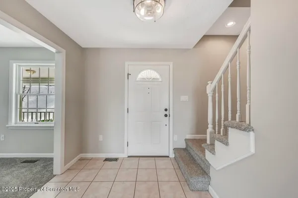 a kitchen with granite countertop a sink stainless steel appliances and cabinets