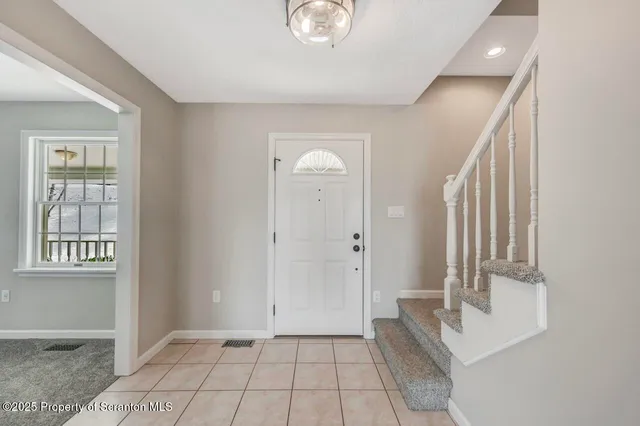 a kitchen with granite countertop a sink stainless steel appliances and cabinets