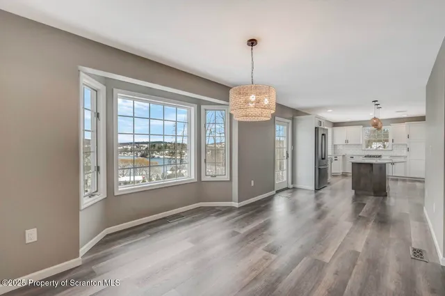 a kitchen with a sink and large window