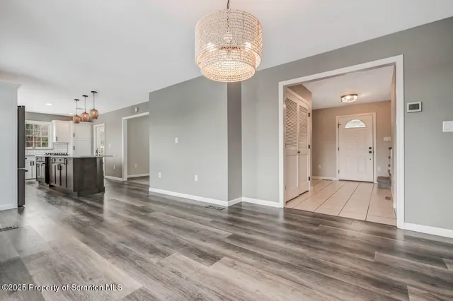 a kitchen with stainless steel appliances granite countertop a stove and a refrigerator