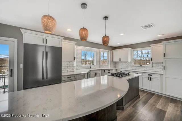 a bathroom with a double vanity sink and a large mirror