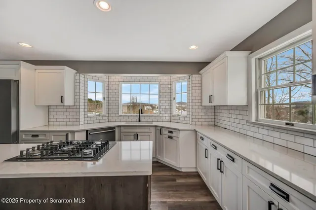 a bathroom with a sink vanity granite and a mirror