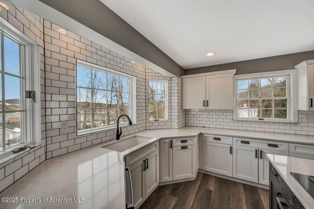 a view of an empty room with glass door