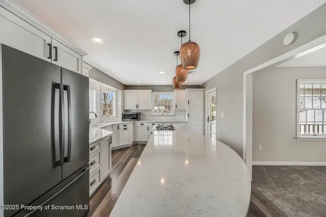 a bathroom with a sink mirror and vanity