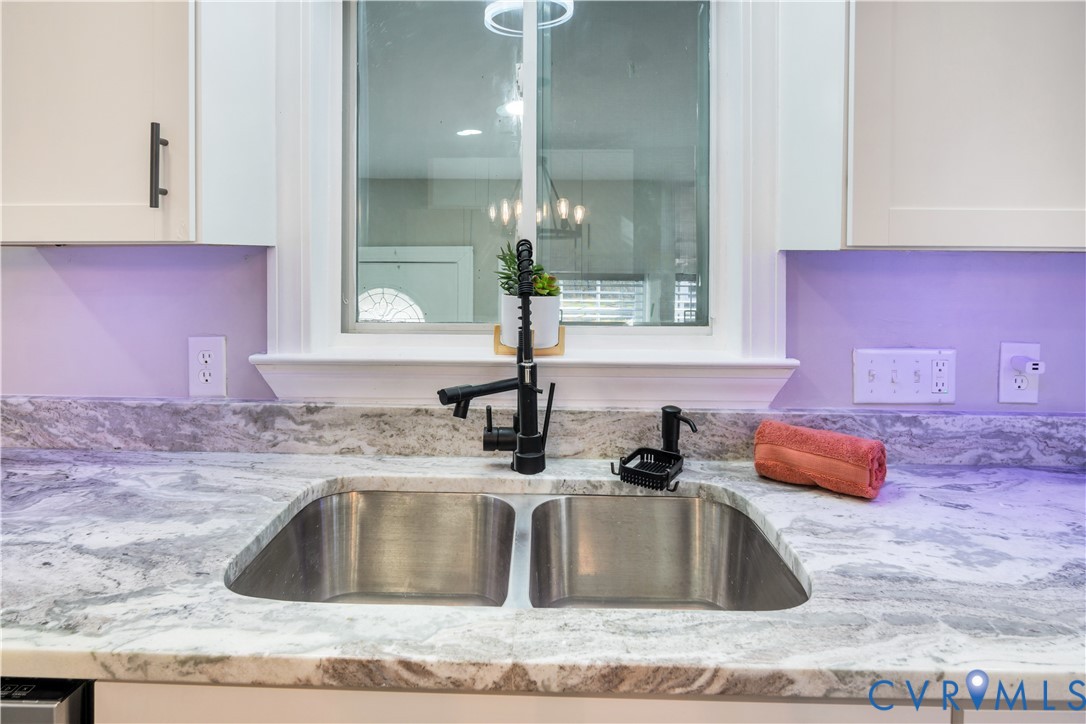 113 Red Dirt Road Williamsburg, VA 23188 - Photo 16 of 41 a kitchen with granite countertop a sink and a granite counter tops
