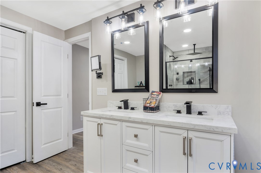 113 Red Dirt Road Williamsburg, VA 23188 - Photo 20 of 41 a bathroom with a double vanity sink and mirror