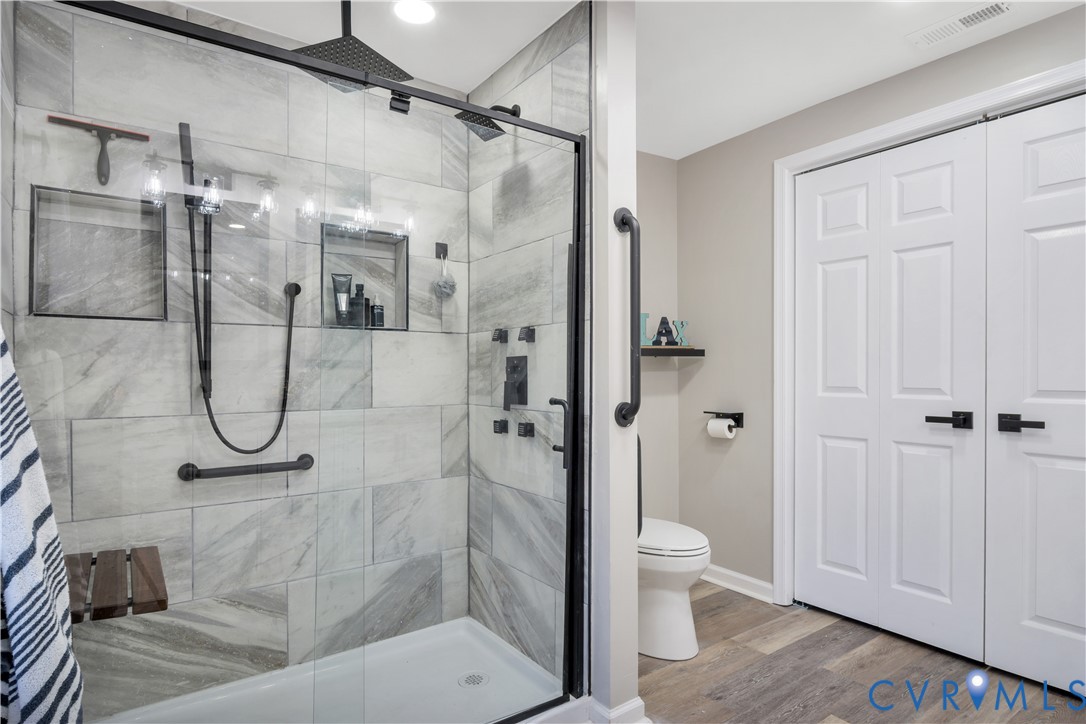113 Red Dirt Road Williamsburg, VA 23188 - Photo 21 of 41 a bathroom with a glass shower door