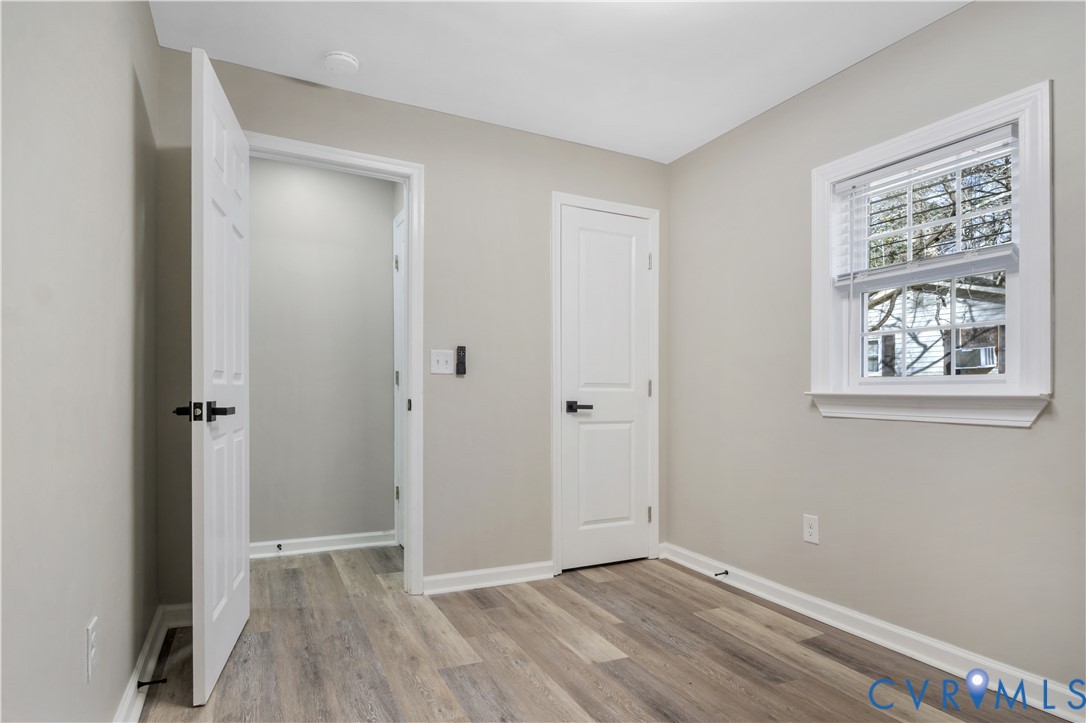 113 Red Dirt Road Williamsburg, VA 23188 - Photo 30 of 41 wooden floor in an empty room with a window