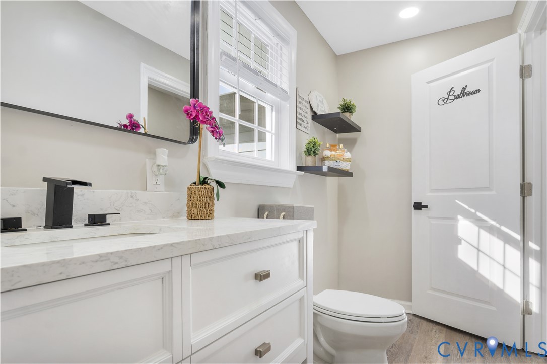113 Red Dirt Road Williamsburg, VA 23188 - Photo 33 of 41 a bathroom with a sink a toilet and a shower curtain
