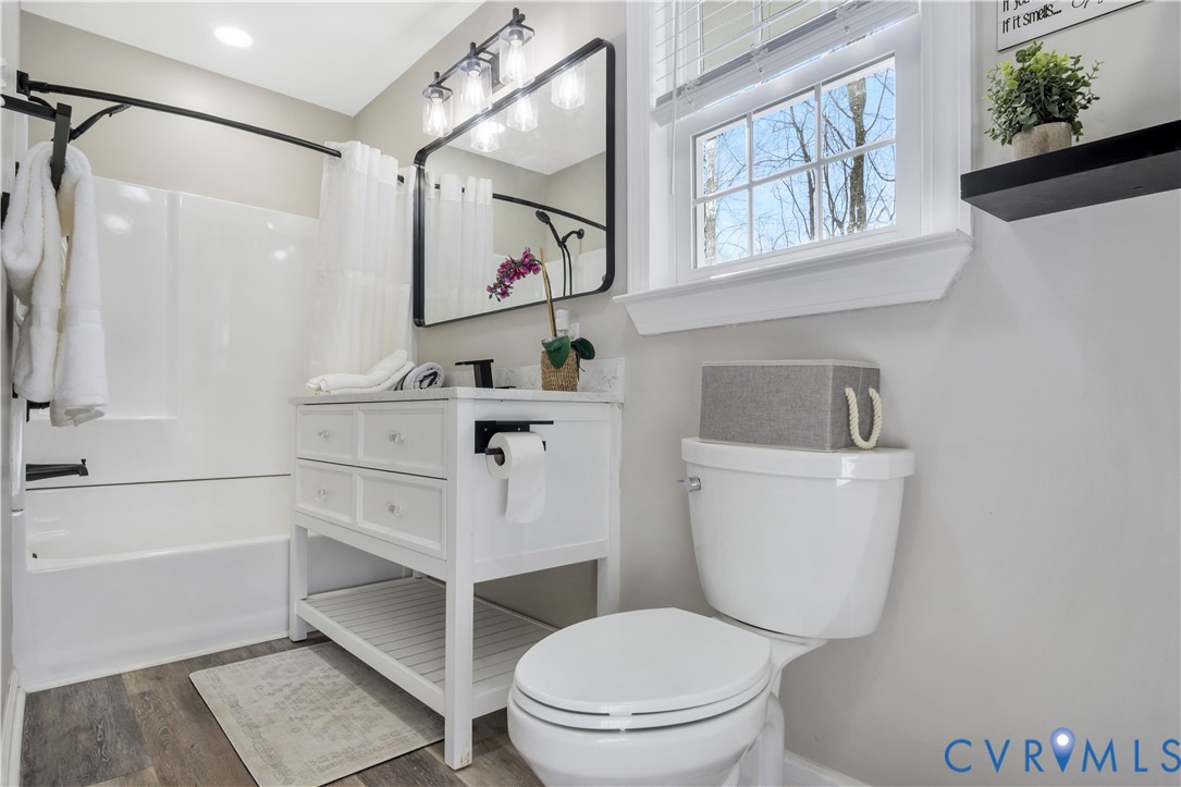 113 Red Dirt Road Williamsburg, VA 23188 - Photo 34 of 41 a white toilet sitting next to a bathroom sink