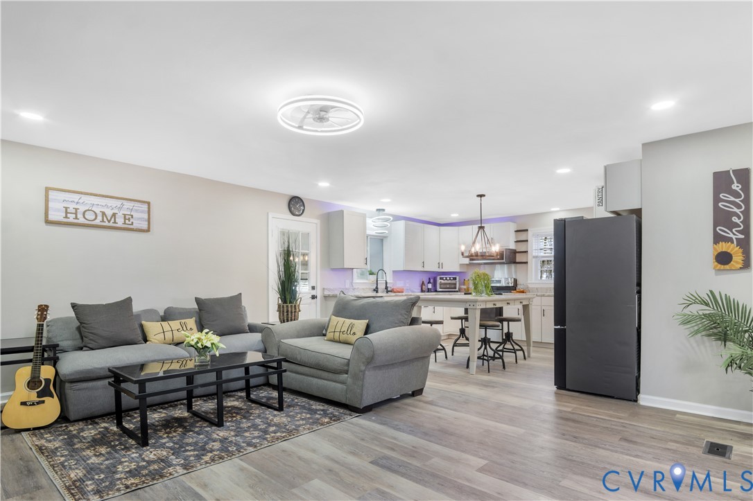 113 Red Dirt Road Williamsburg, VA 23188 - Photo 10 of 41 a living room with furniture and a refrigerator
