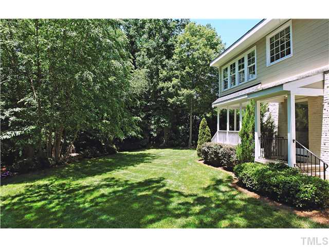 611 Runnymede Road Raleigh, NC 27607 - Photo 12 of 25 a front view of a house with a yard