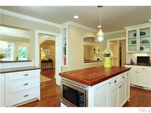 611 Runnymede Road Raleigh, NC 27607 - Photo 17 of 25 a kitchen with a stove a sink and a refrigerator