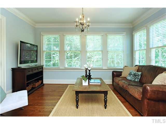 611 Runnymede Road Raleigh, NC 27607 - Photo 5 of 25 a living room with furniture and a flat screen tv