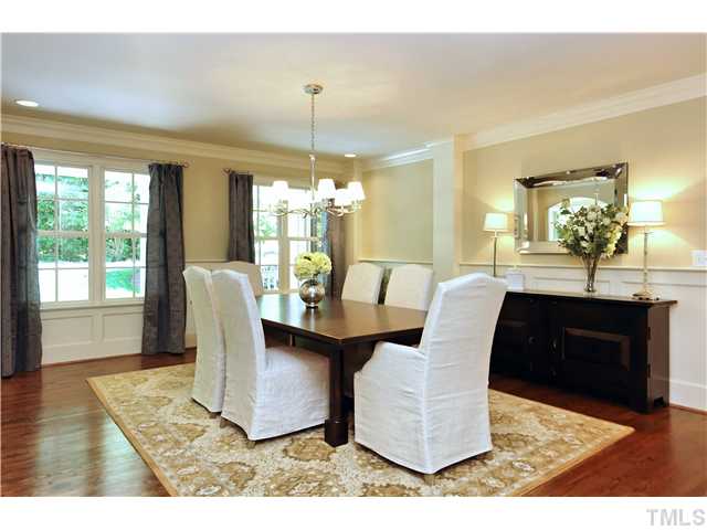 611 Runnymede Road Raleigh, NC 27607 - Photo 7 of 25 a dining room with furniture a chandelier and wooden floor
