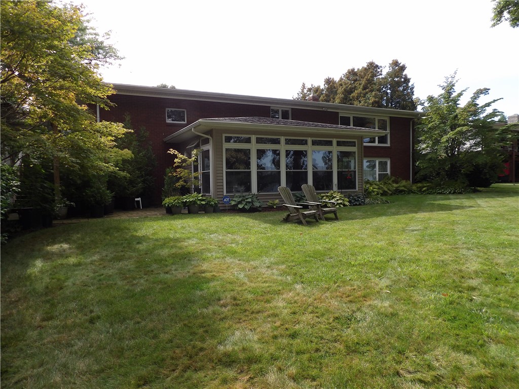 6416 Ann Lee Drive Huron, NY 14516 - Photo 4 of 24 Waterfront side of exterior, enclosed porch