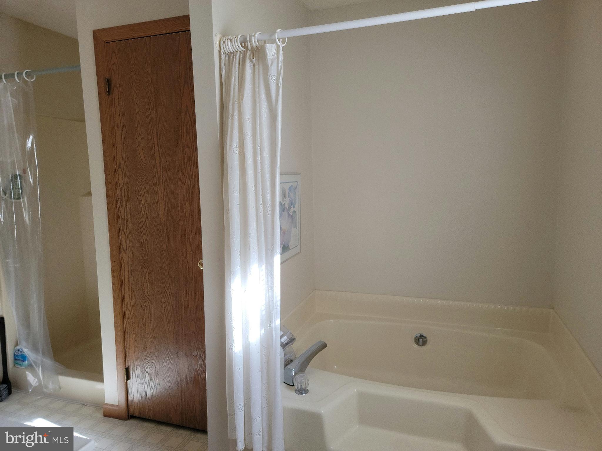 923 Crystal Rock Road Lusby, MD 20657 - Photo 8 of 26 Primary bath with sep shower and tub