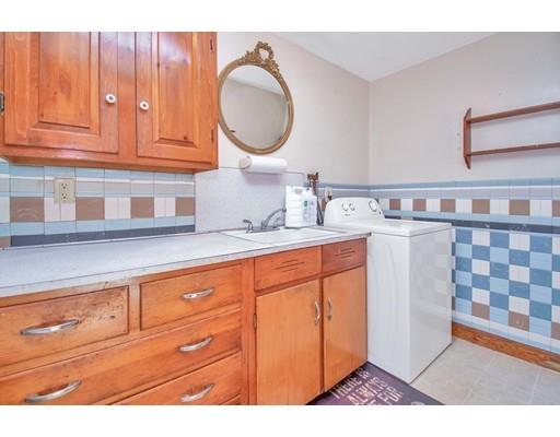 36 Sabin Street Springfield, MA 01151 - Photo 12 of 33 a bathroom with a sink a mirror and cabinets