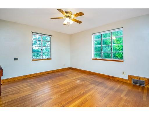 36 Sabin Street Springfield, MA 01151 - Photo 13 of 33 a view of an empty room with window and wooden floor
