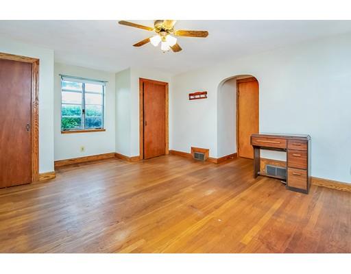 36 Sabin Street Springfield, MA 01151 - Photo 14 of 33 a view of an empty room with a window and wooden floor