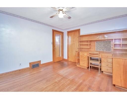 36 Sabin Street Springfield, MA 01151 - Photo 16 of 33 a view of livingroom with furniture chandelier fan and fireplace