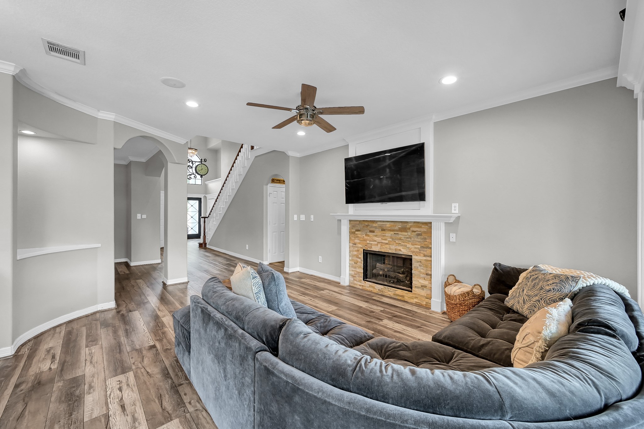 12394 Pebble View Drive Conroe, TX 77304 - Photo 12 of 49 a living room with furniture fireplace and a flat screen tv