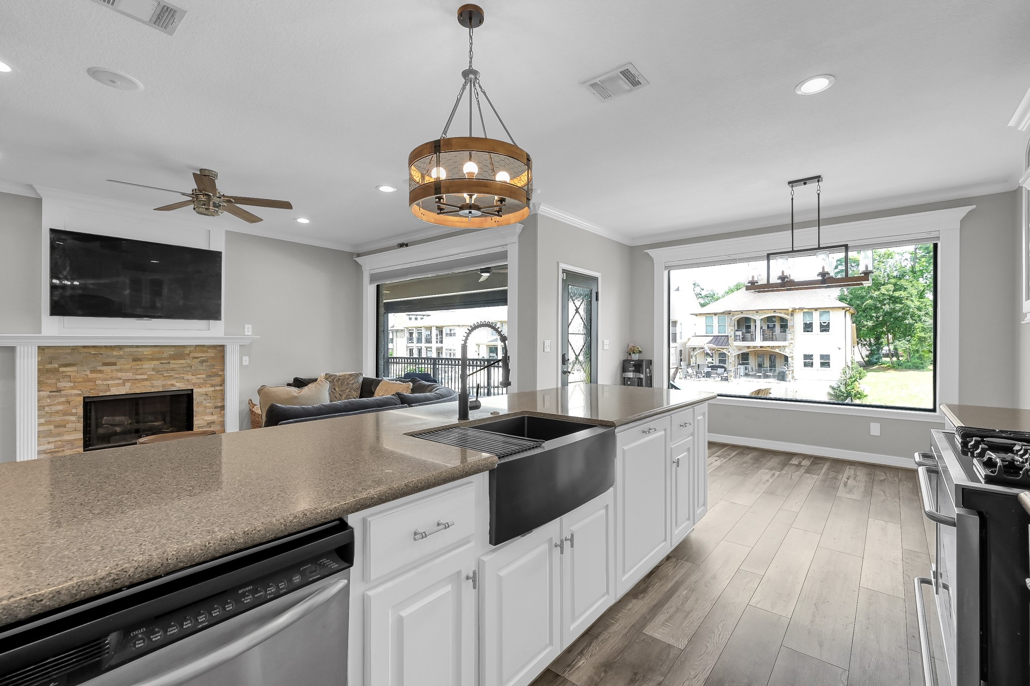 12394 Pebble View Drive Conroe, TX 77304 - Photo 16 of 49 Enjoy stunning views through expansive picture windows, with space for a cozy breakfast table to soak in the scenery.