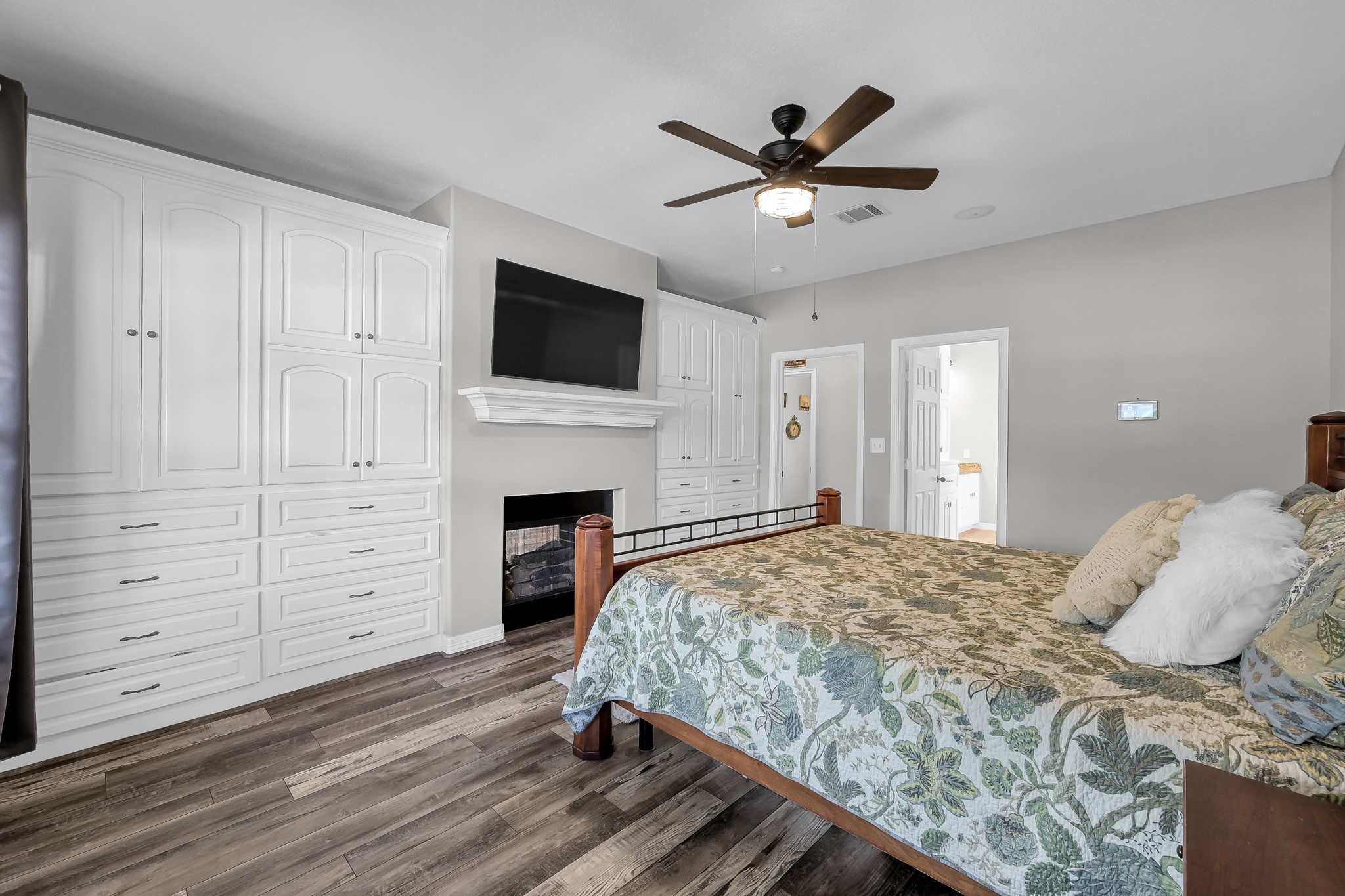 12394 Pebble View Drive Conroe, TX 77304 - Photo 20 of 49 a bedroom with a large bed and a flat screen tv