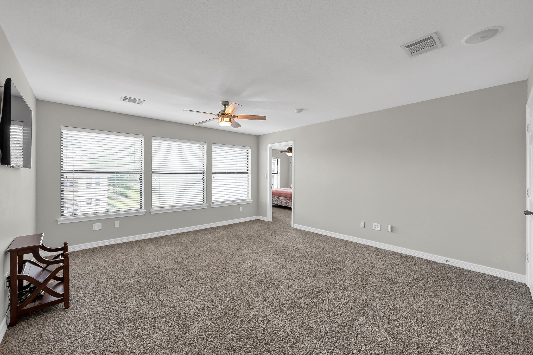 12394 Pebble View Drive Conroe, TX 77304 - Photo 23 of 49 Spacious second-floor family or game room with stunning water views through expansive windows.