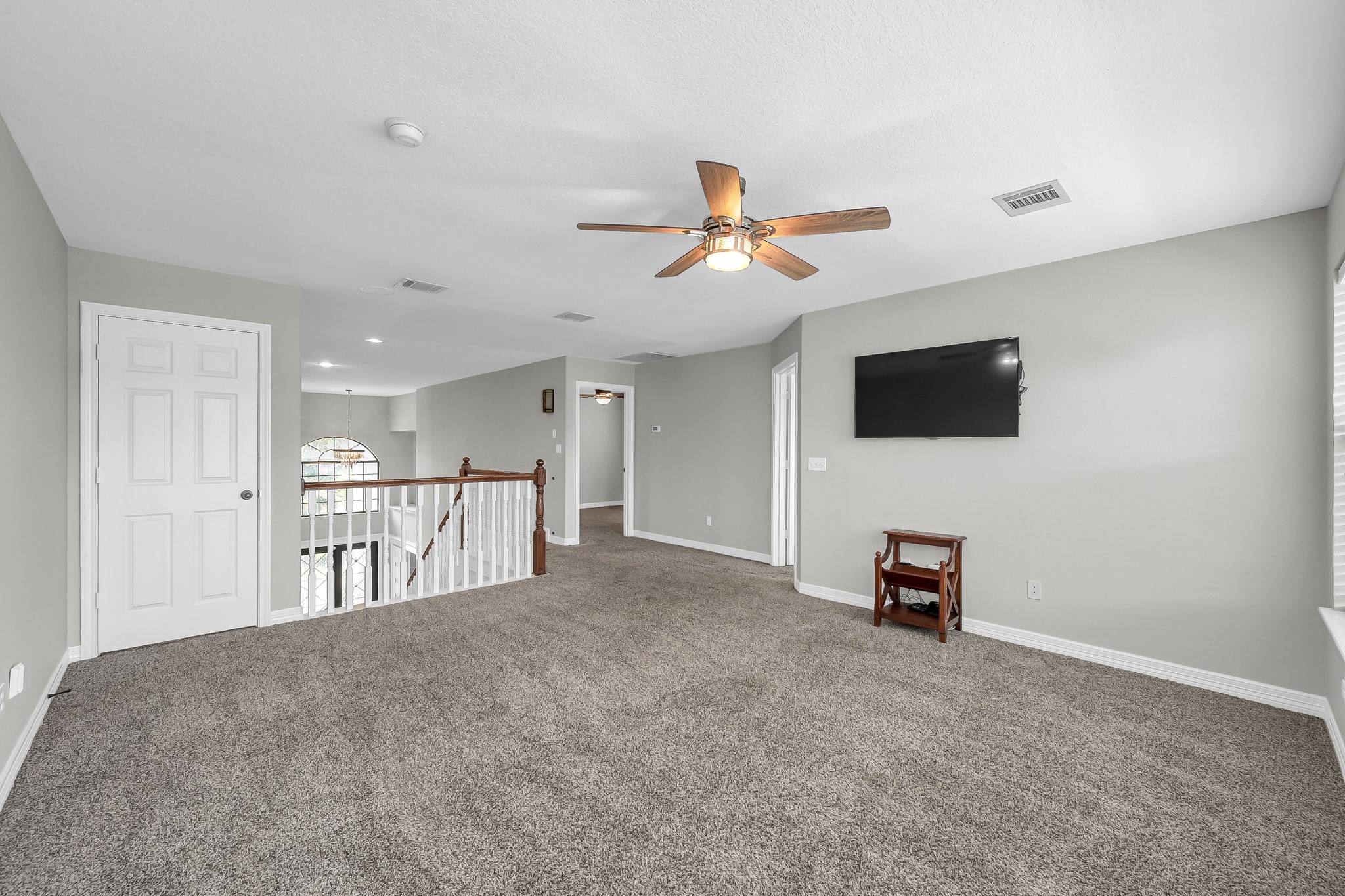 12394 Pebble View Drive Conroe, TX 77304 - Photo 24 of 49 a view of livingroom with furniture and a flat screen tv