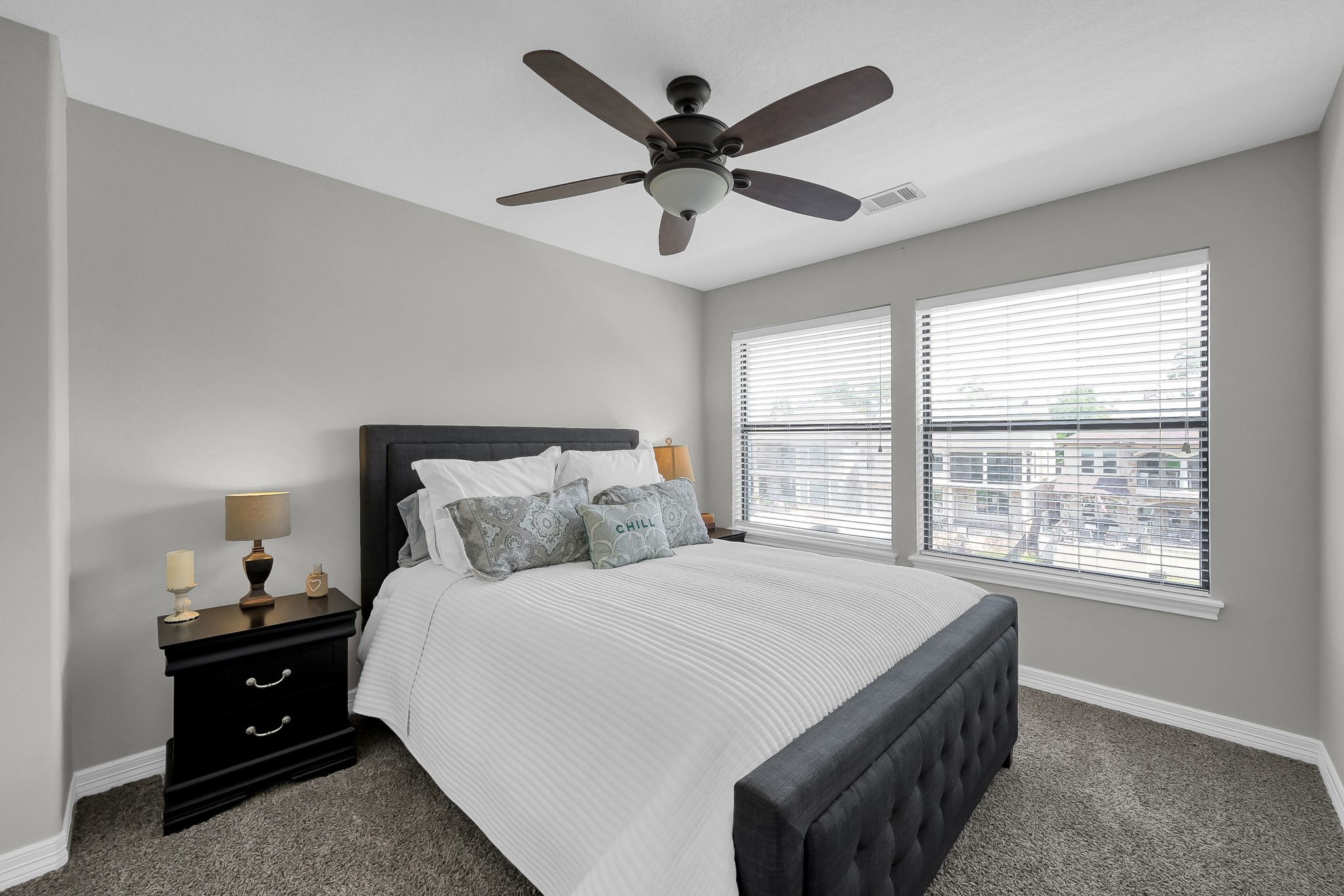 12394 Pebble View Drive Conroe, TX 77304 - Photo 27 of 49 a bedroom with a bed and window