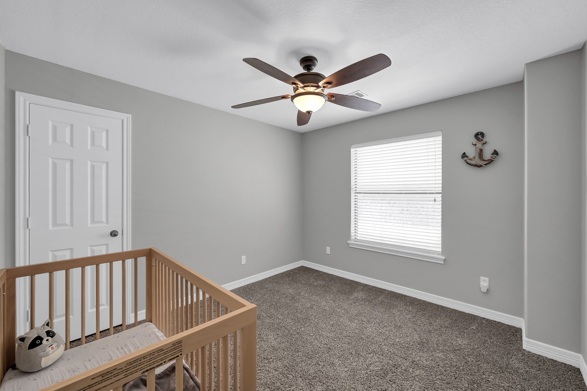 12394 Pebble View Drive Conroe, TX 77304 - Photo 29 of 49 Bedroom 3 on the second floor—ideal for a cozy nursery.