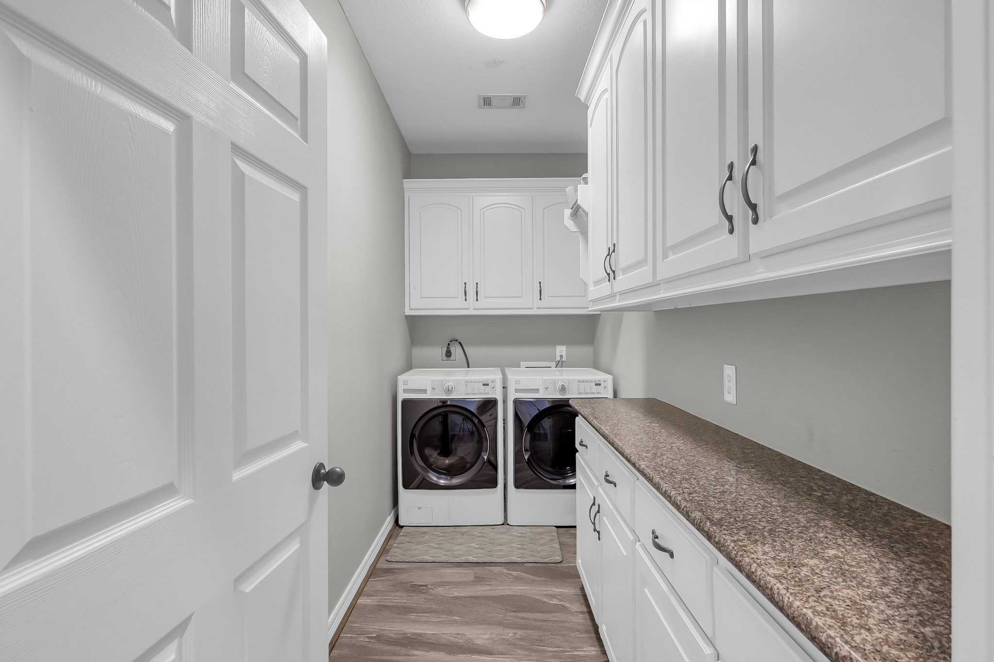 12394 Pebble View Drive Conroe, TX 77304 - Photo 31 of 49 a kitchen with stainless steel appliances granite countertop a stove and a sink