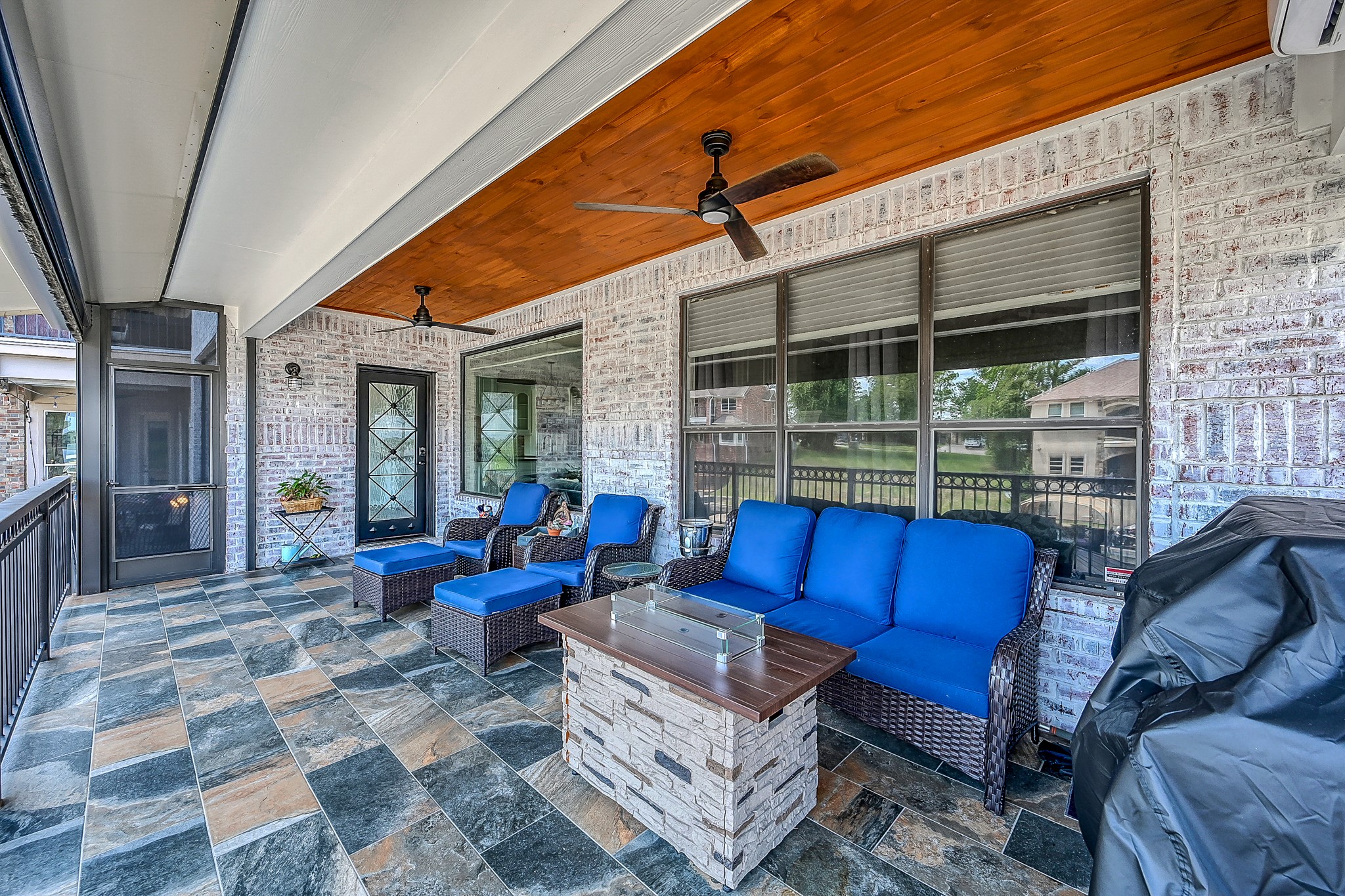 12394 Pebble View Drive Conroe, TX 77304 - Photo 33 of 49 Experience elegance with a stunning slate tile floor and a charming wooden ceiling.