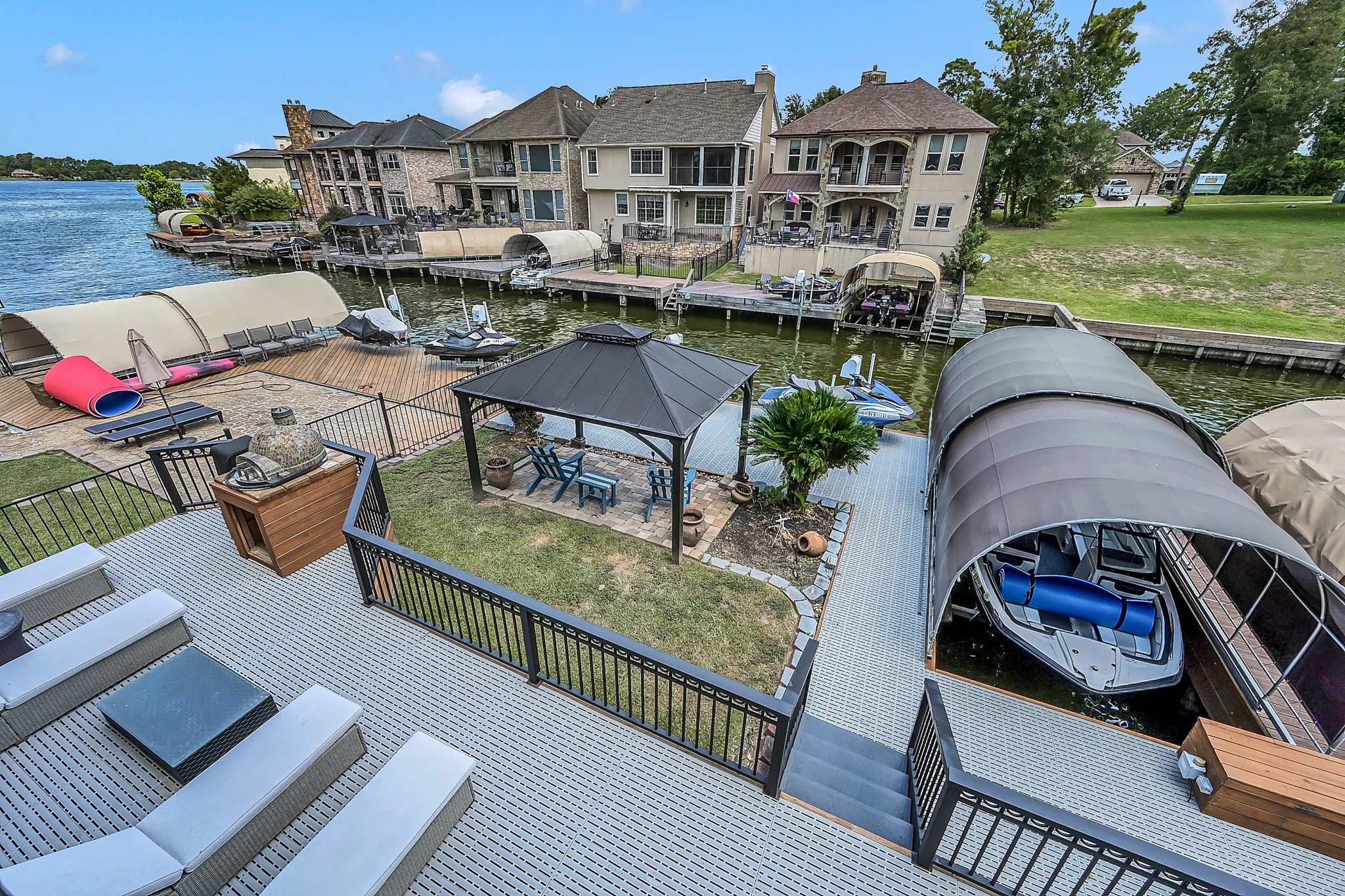 12394 Pebble View Drive Conroe, TX 77304 - Photo 34 of 49 Spectacular balcony view of the lower deck, canal, and lake—perfect for relaxing or entertaining.