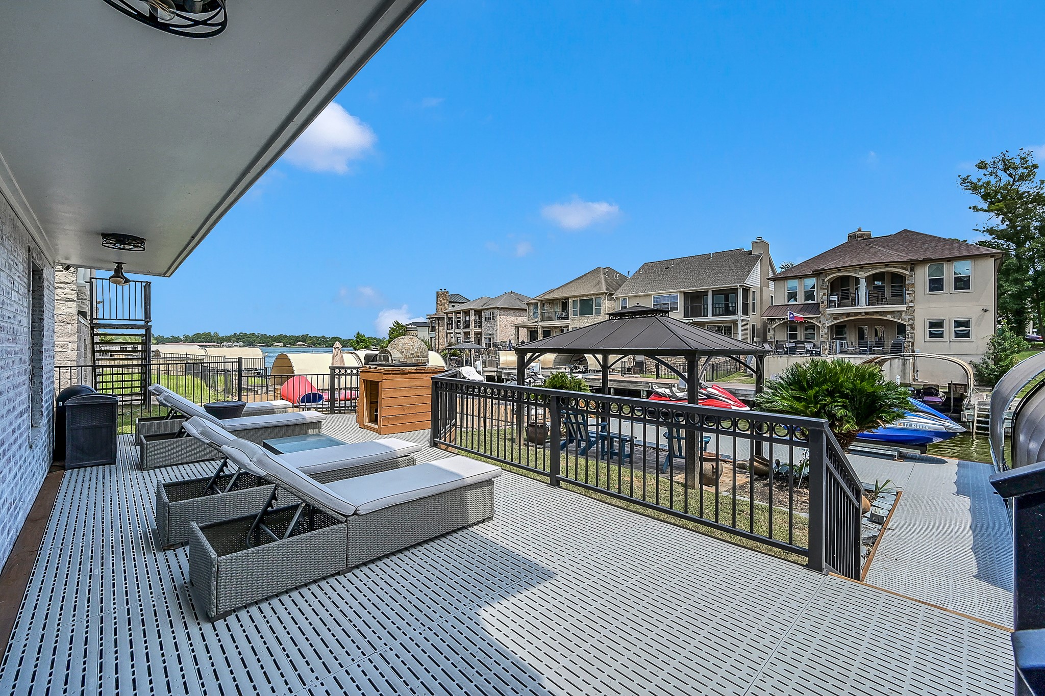 12394 Pebble View Drive Conroe, TX 77304 - Photo 35 of 49 Enjoy sunbathing on this gorgeous deck while watching the lake and beautiful sunsets.
