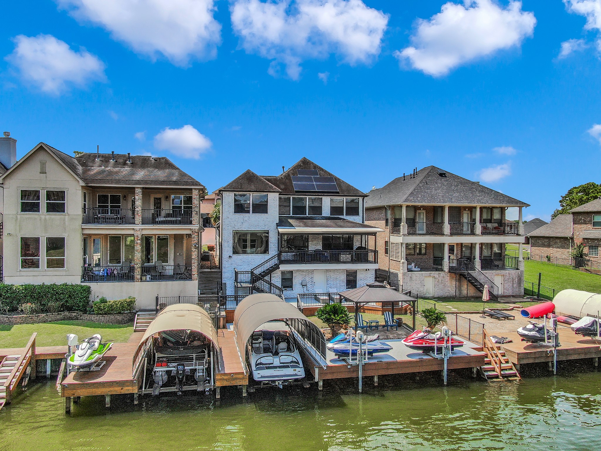 12394 Pebble View Drive Conroe, TX 77304 - Photo 41 of 49 Aerial view showing docks, boat lift, jet ski lifts and stairs to water.