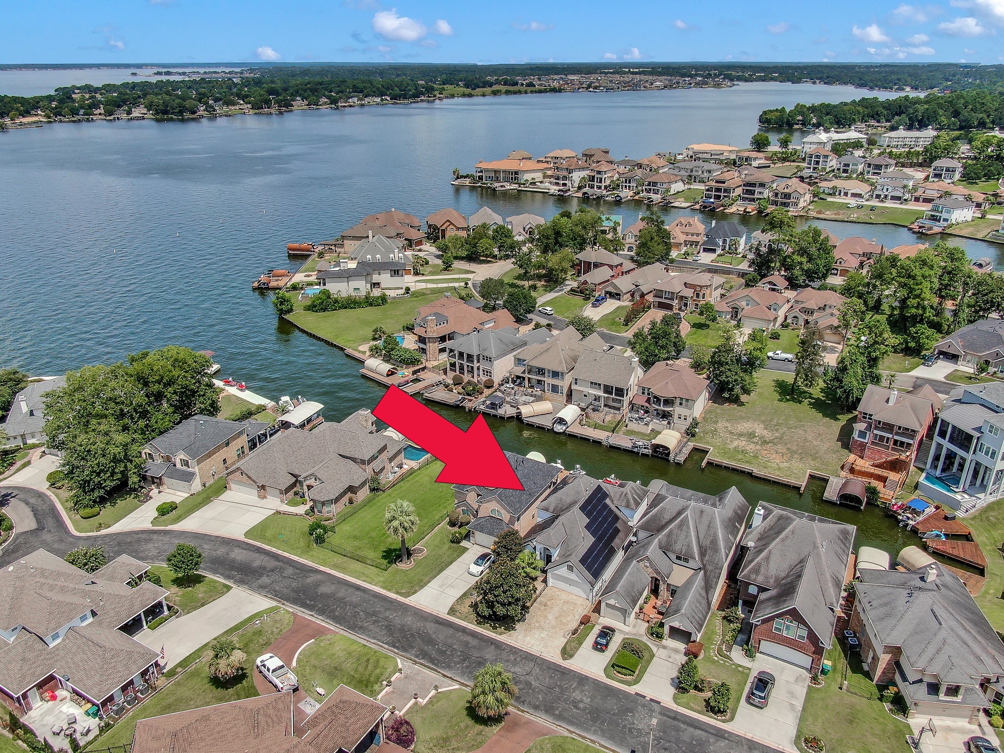 12394 Pebble View Drive Conroe, TX 77304 - Photo 47 of 49 an aerial view of a city with lake view