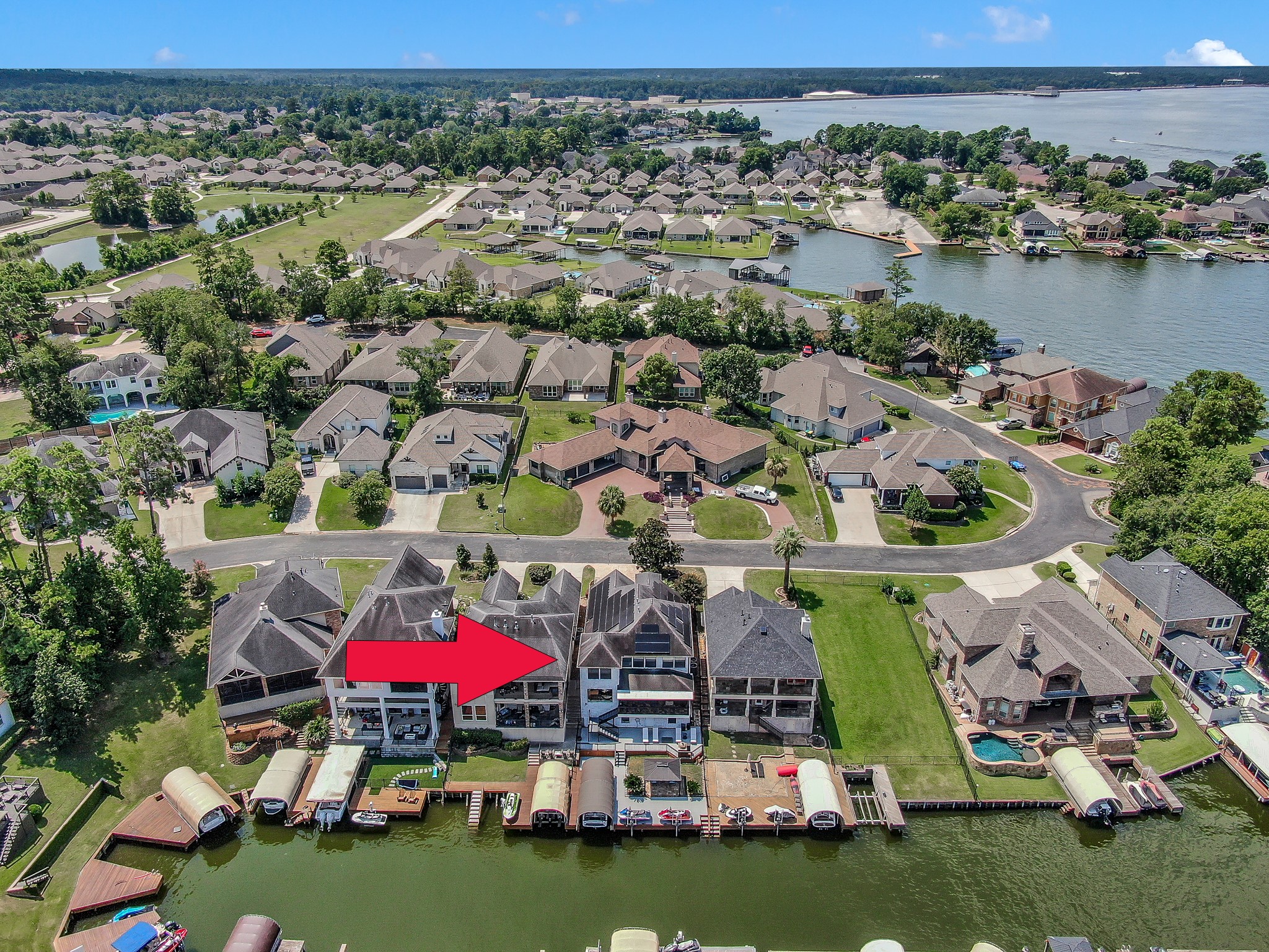12394 Pebble View Drive Conroe, TX 77304 - Photo 49 of 49 an aerial view of residential houses with outdoor space and lake view