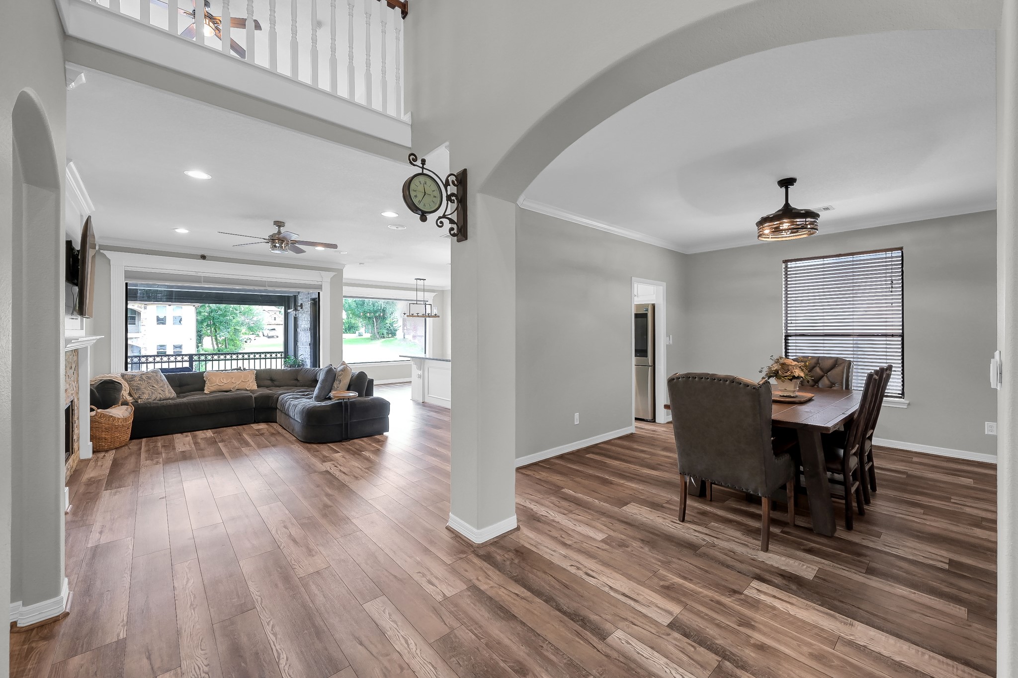 12394 Pebble View Drive Conroe, TX 77304 - Photo 7 of 49 Experience seamless flow in spacious living areas, connecting the elegant dining room to the inviting family room.