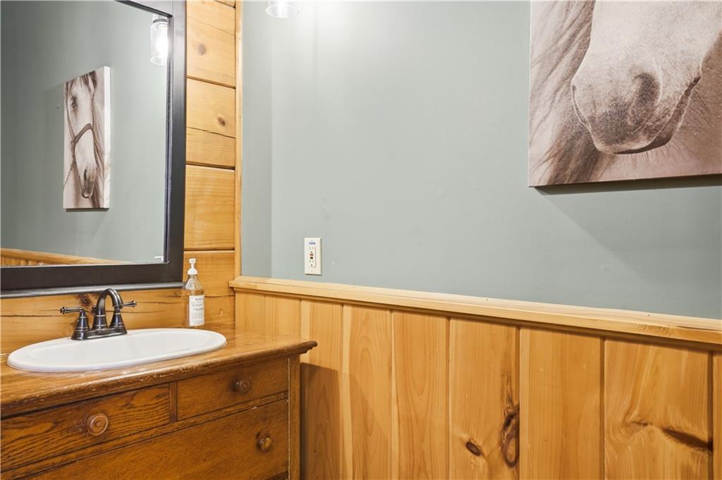 2865 Hightower Road Ball Ground, GA 30107 - Photo 15 of 41 a bathroom with a sink and a mirror