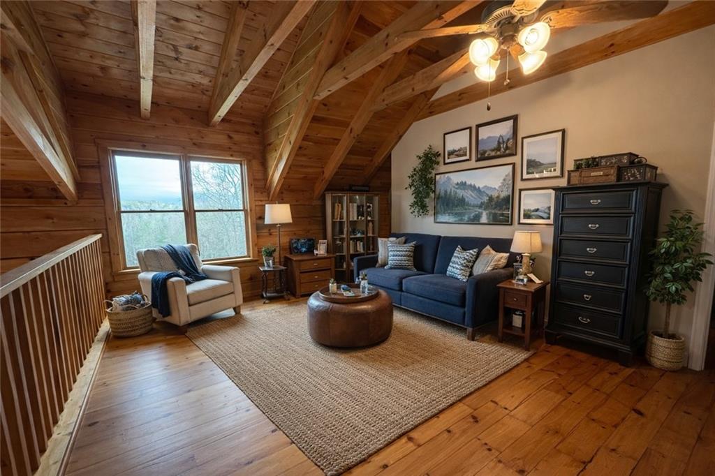 2865 Hightower Road Ball Ground, GA 30107 - Photo 23 of 41 a living room with furniture and wooden floor