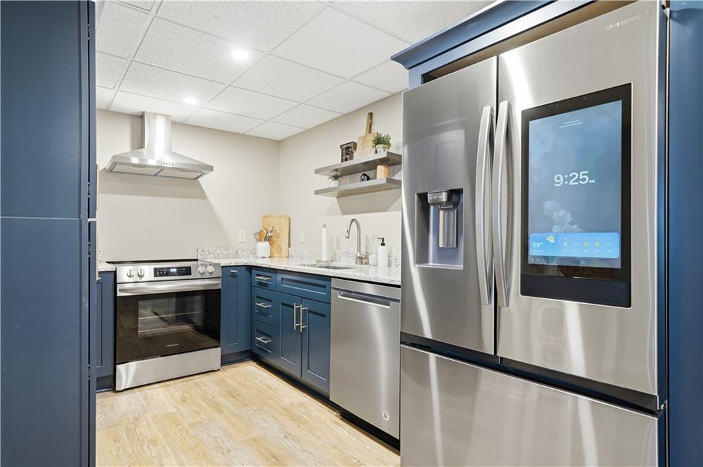 2865 Hightower Road Ball Ground, GA 30107 - Photo 27 of 41 a kitchen with stainless steel appliances granite countertop a refrigerator and a stove